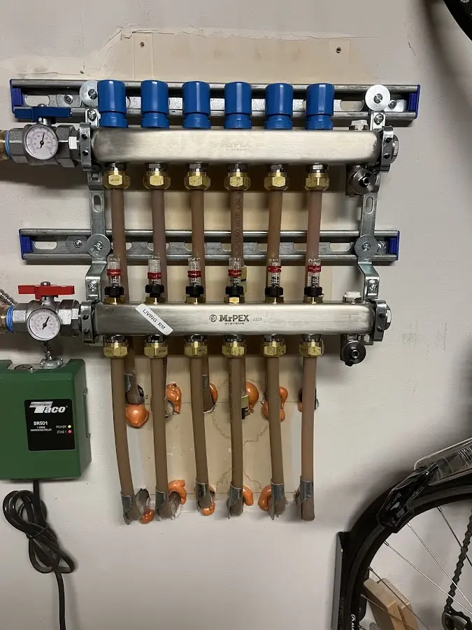 Plumber performing Water Heater Repair at a residential property in Chestnut Ridge